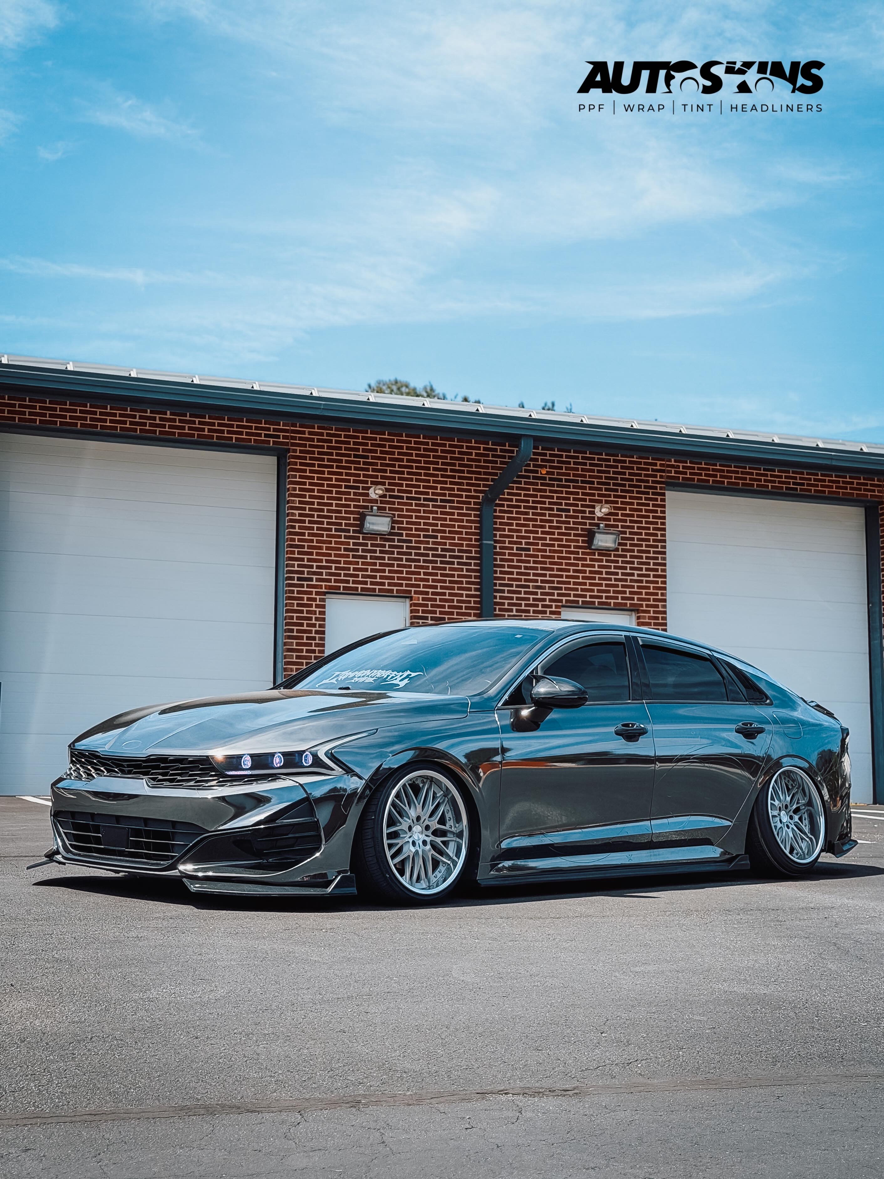 Gloss black wrapped car side profile