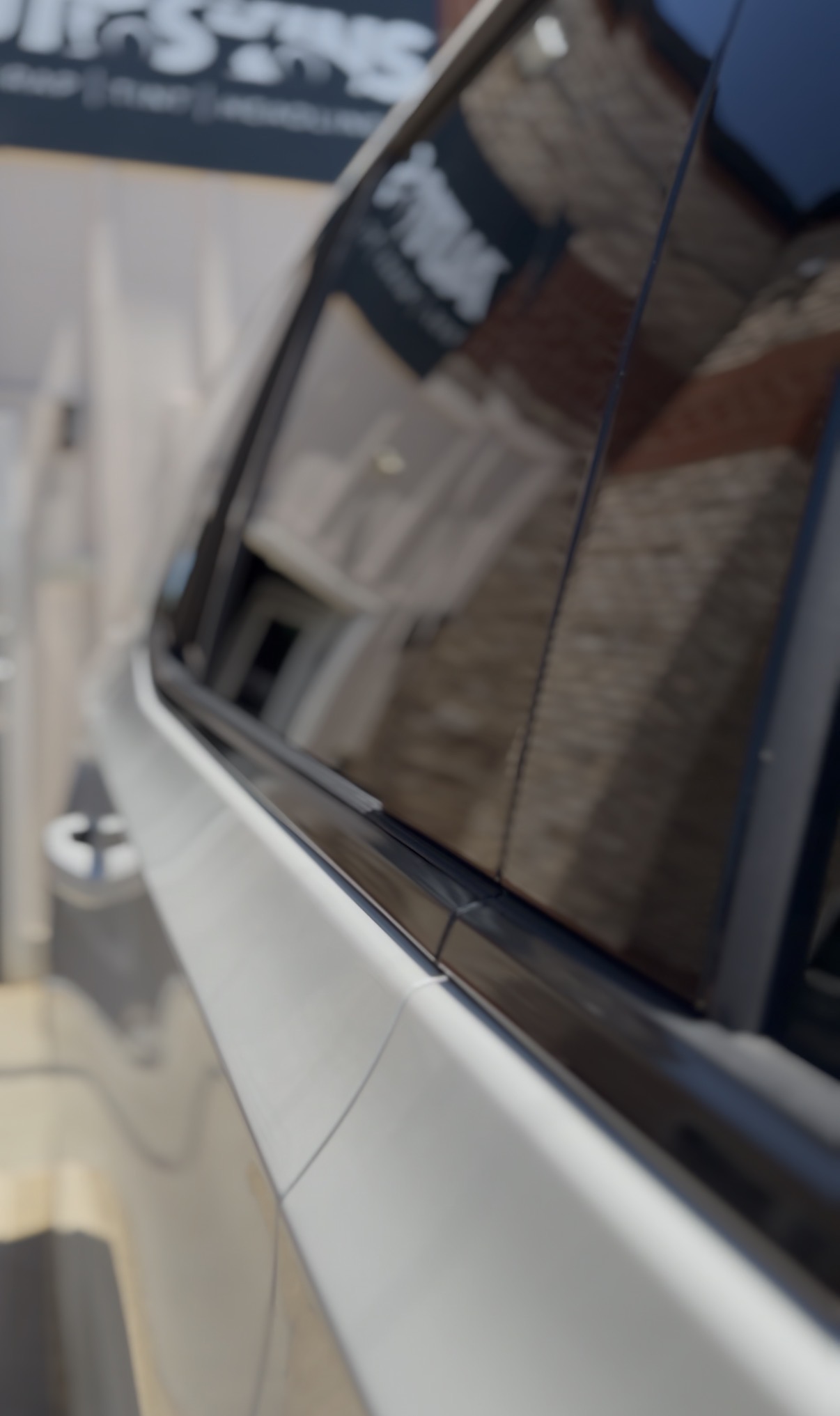 Blackout window trim closeup after chrome delete